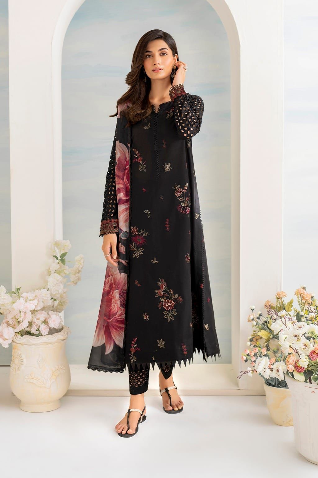 A high-quality lawn suit featuring: - Kapra Collection