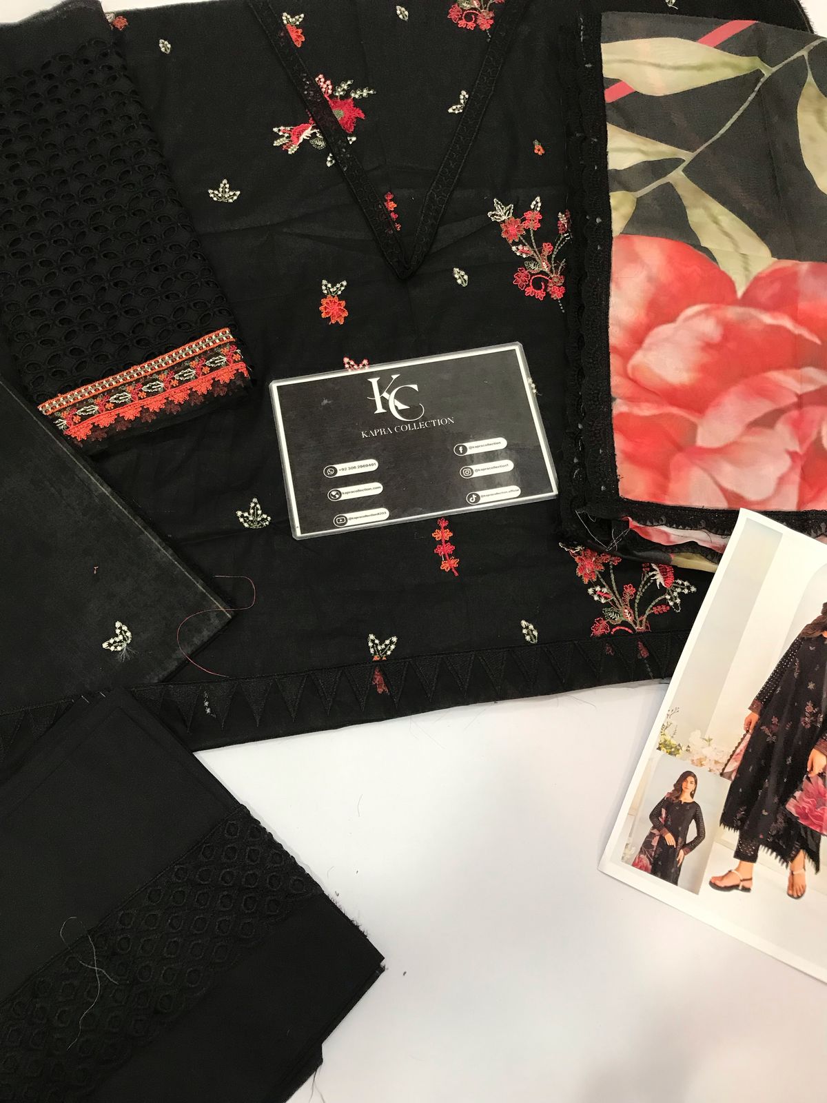 A high-quality lawn suit featuring: - Kapra Collection