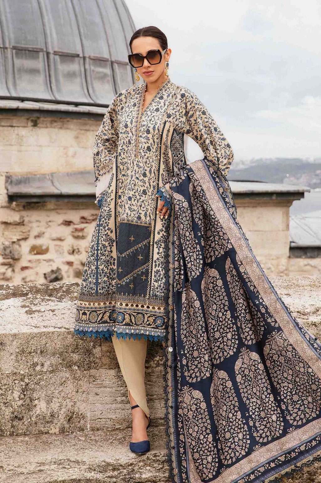 3-piece unstitched printed lawn suit in the "M print" style. These are typically fabric sets for making summer outfits The three pieces usually include: - Kapra Collection