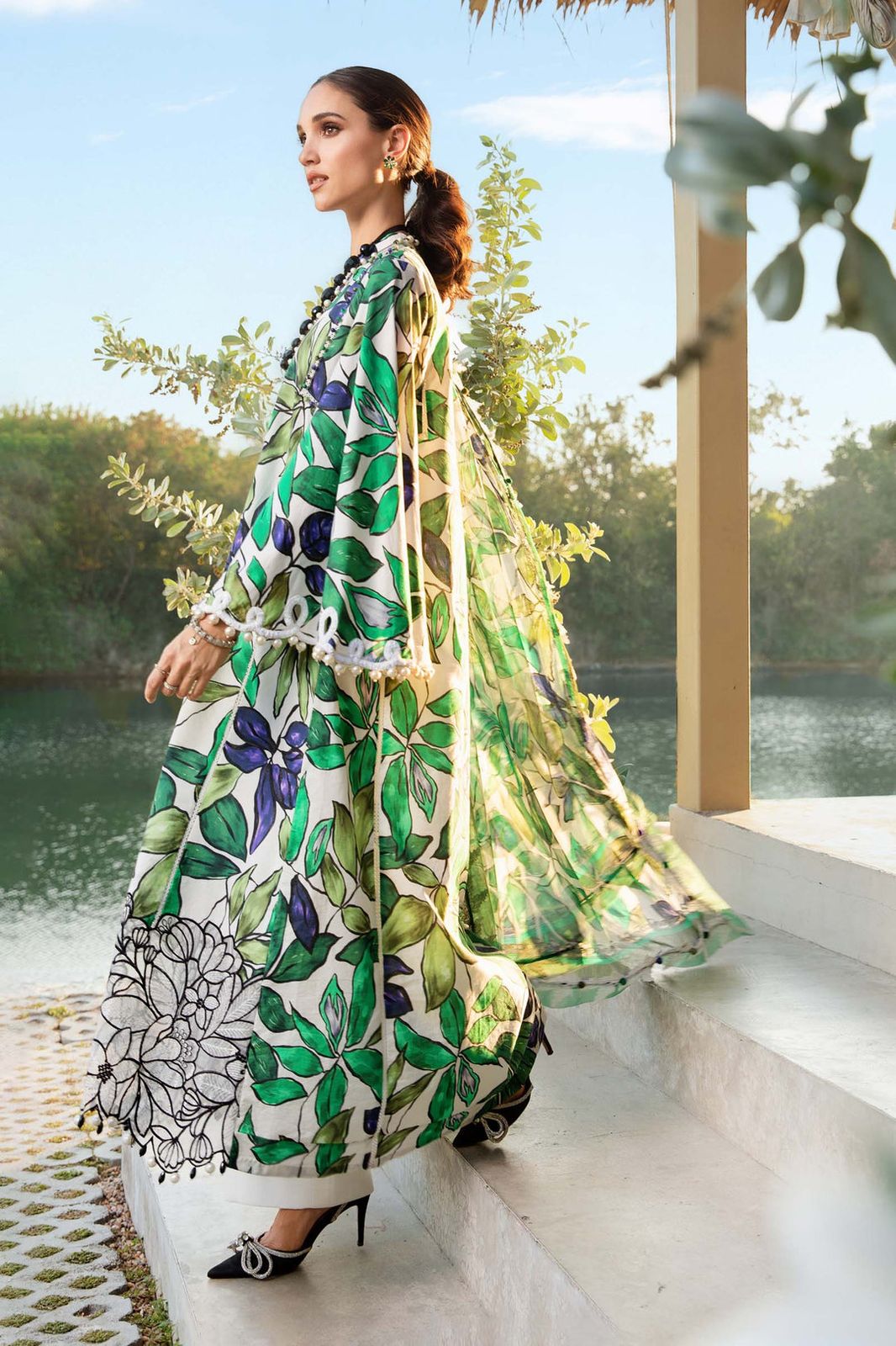 3-piece unstitched printed lawn suit in the "M print" style. These are typically fabric sets for making summer outfits The three pieces usually include: - Kapra Collection