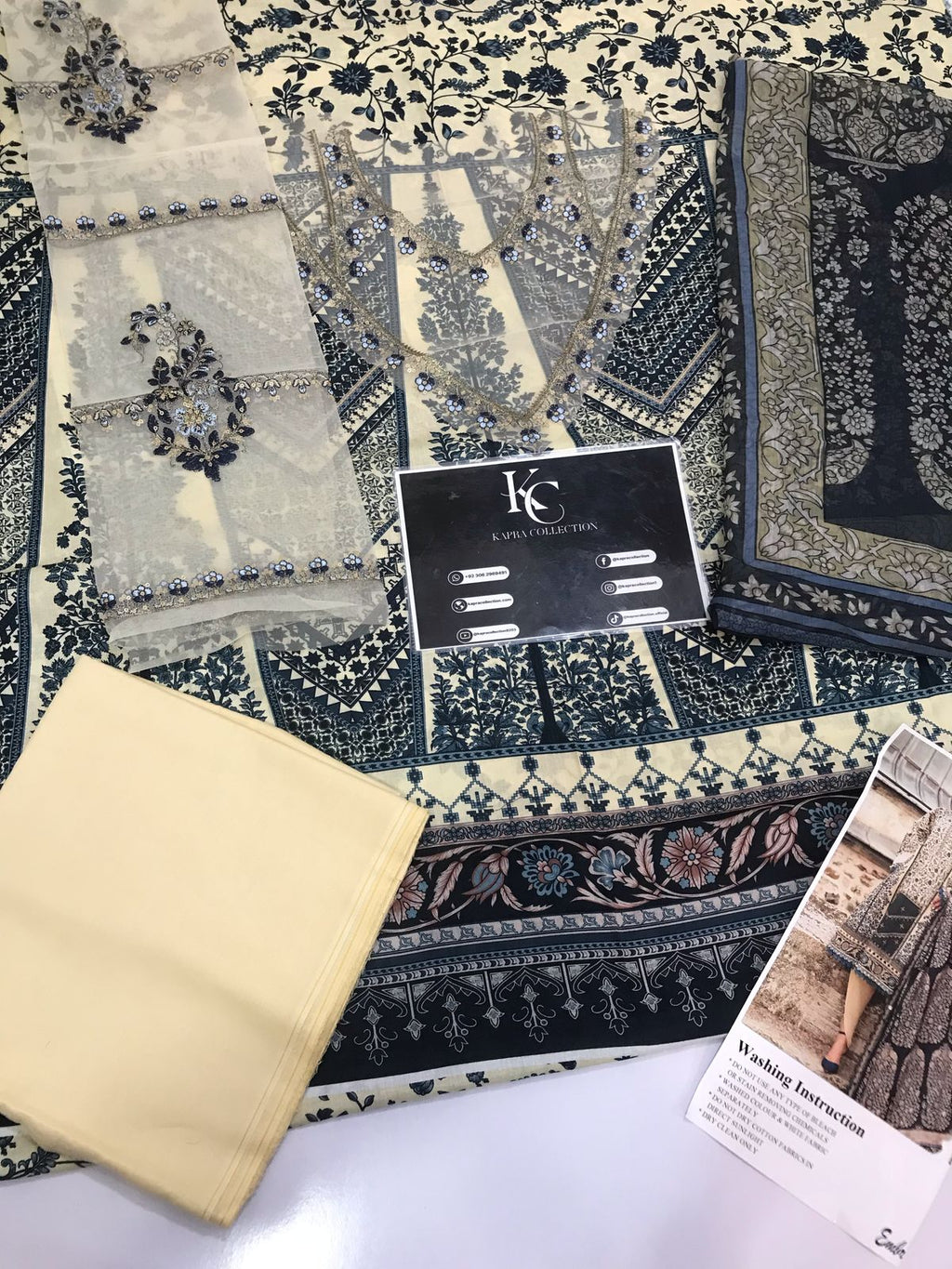 3-piece unstitched printed lawn suit in the "M print" style. These are typically fabric sets for making summer outfits The three pieces usually include: - Kapra Collection