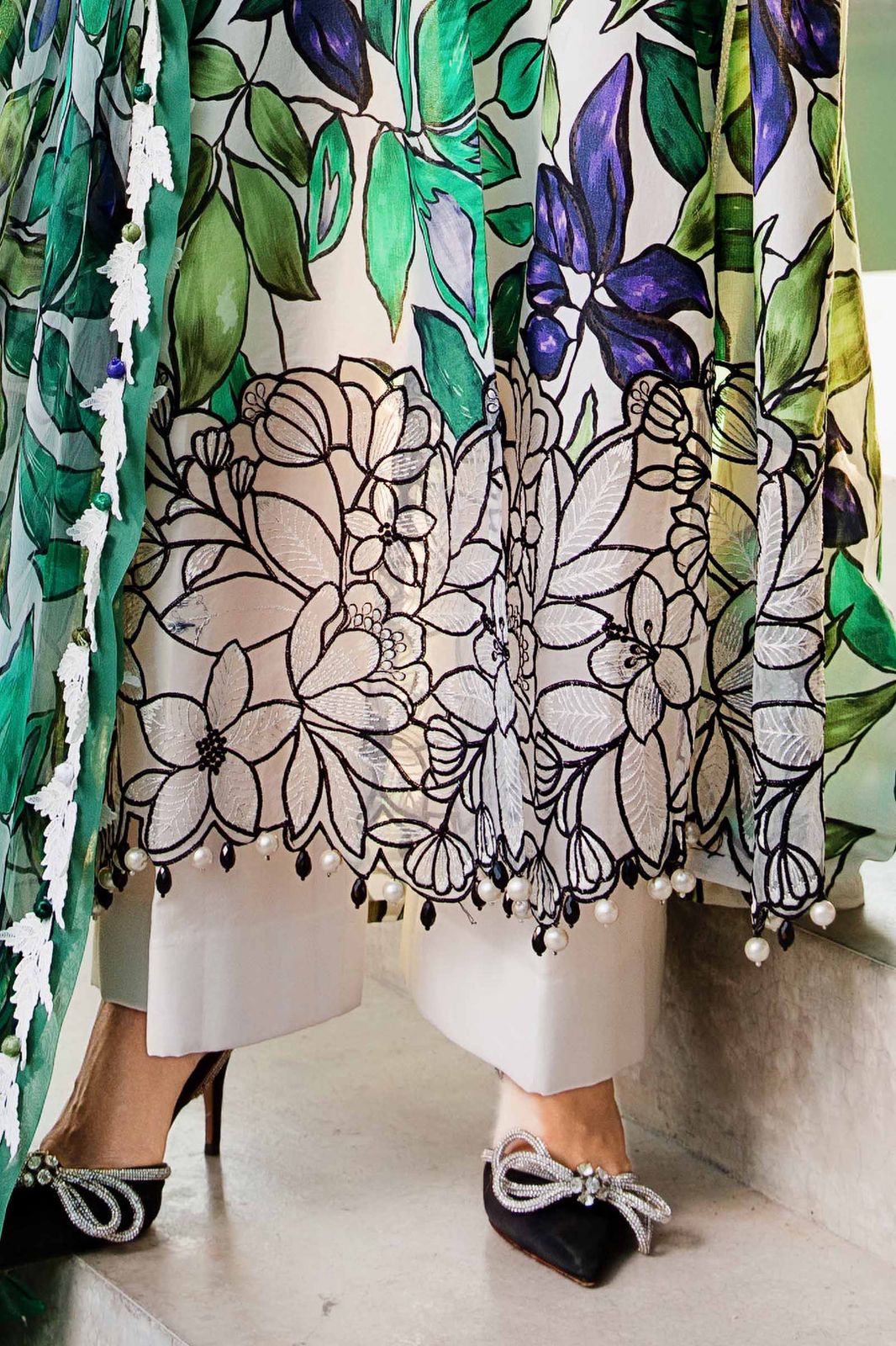 3-piece unstitched printed lawn suit in the "M print" style. These are typically fabric sets for making summer outfits The three pieces usually include: - Kapra Collection