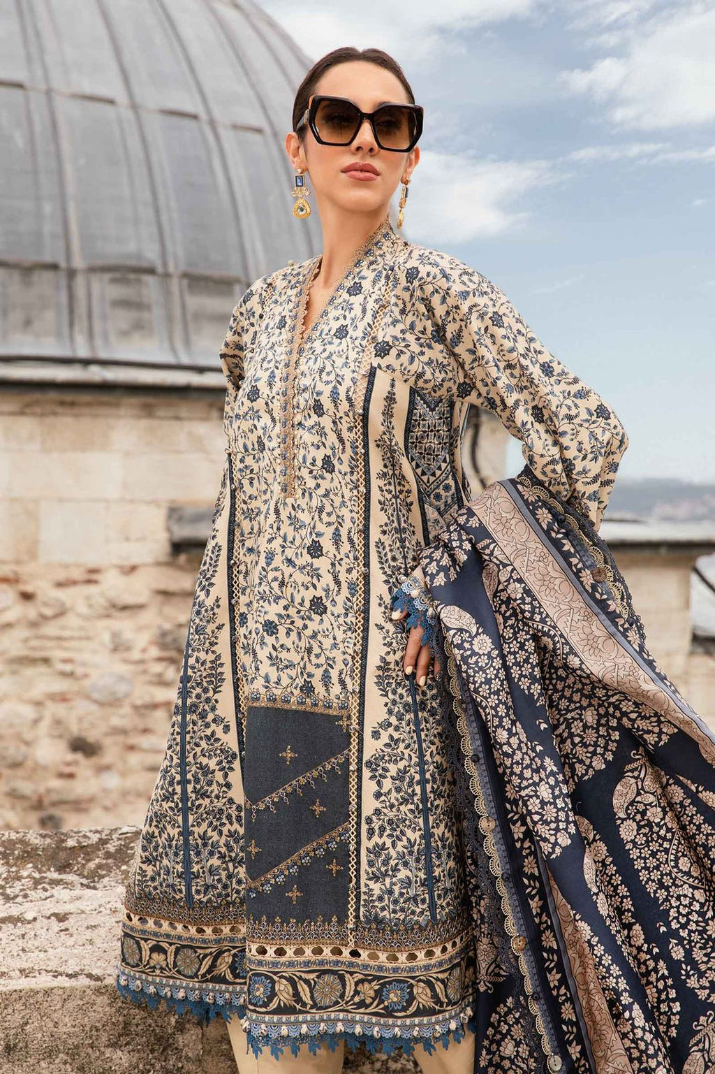 3-piece unstitched printed lawn suit in the "M print" style. These are typically fabric sets for making summer outfits The three pieces usually include: - Kapra Collection