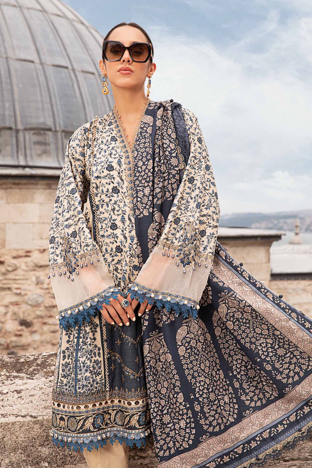 3-piece unstitched printed lawn suit in the "M print" style. These are typically fabric sets for making summer outfits The three pieces usually include: - Kapra Collection